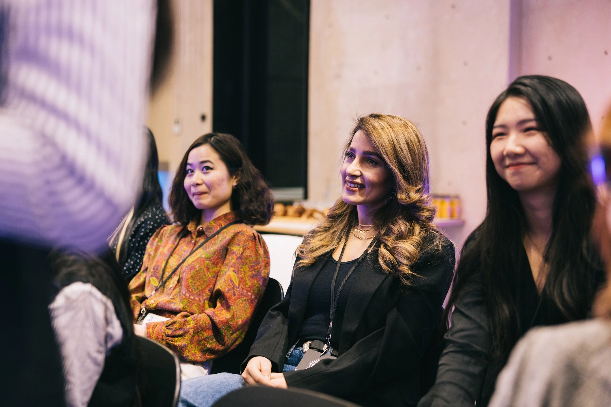 Audience listening to a tech talk at a community event