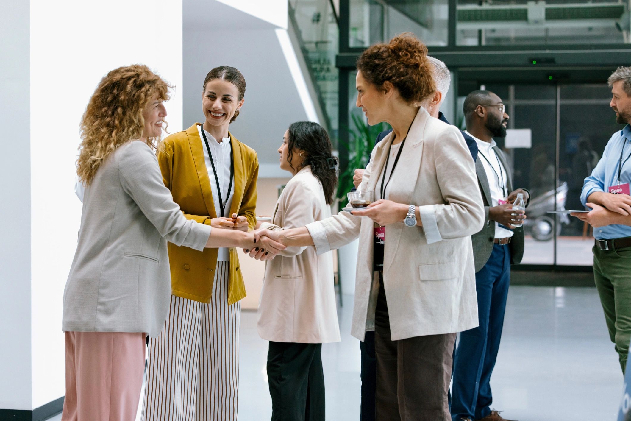 Women networking and introducing one another at an event